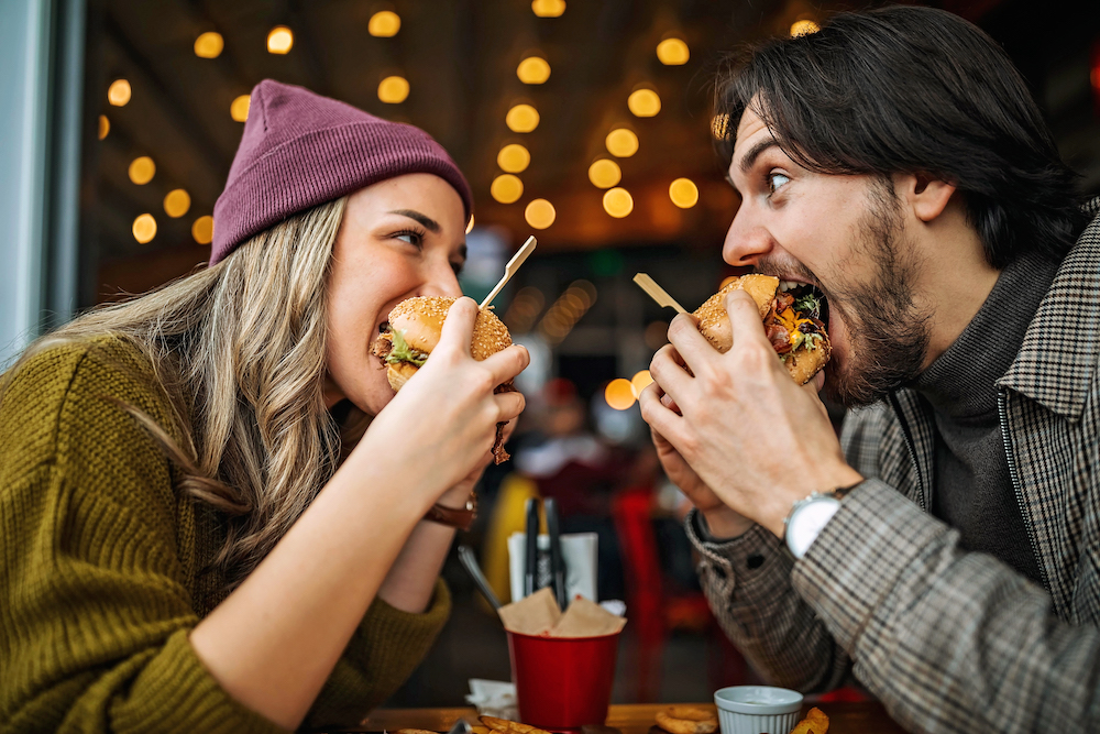 couple out to lunch eating burgers